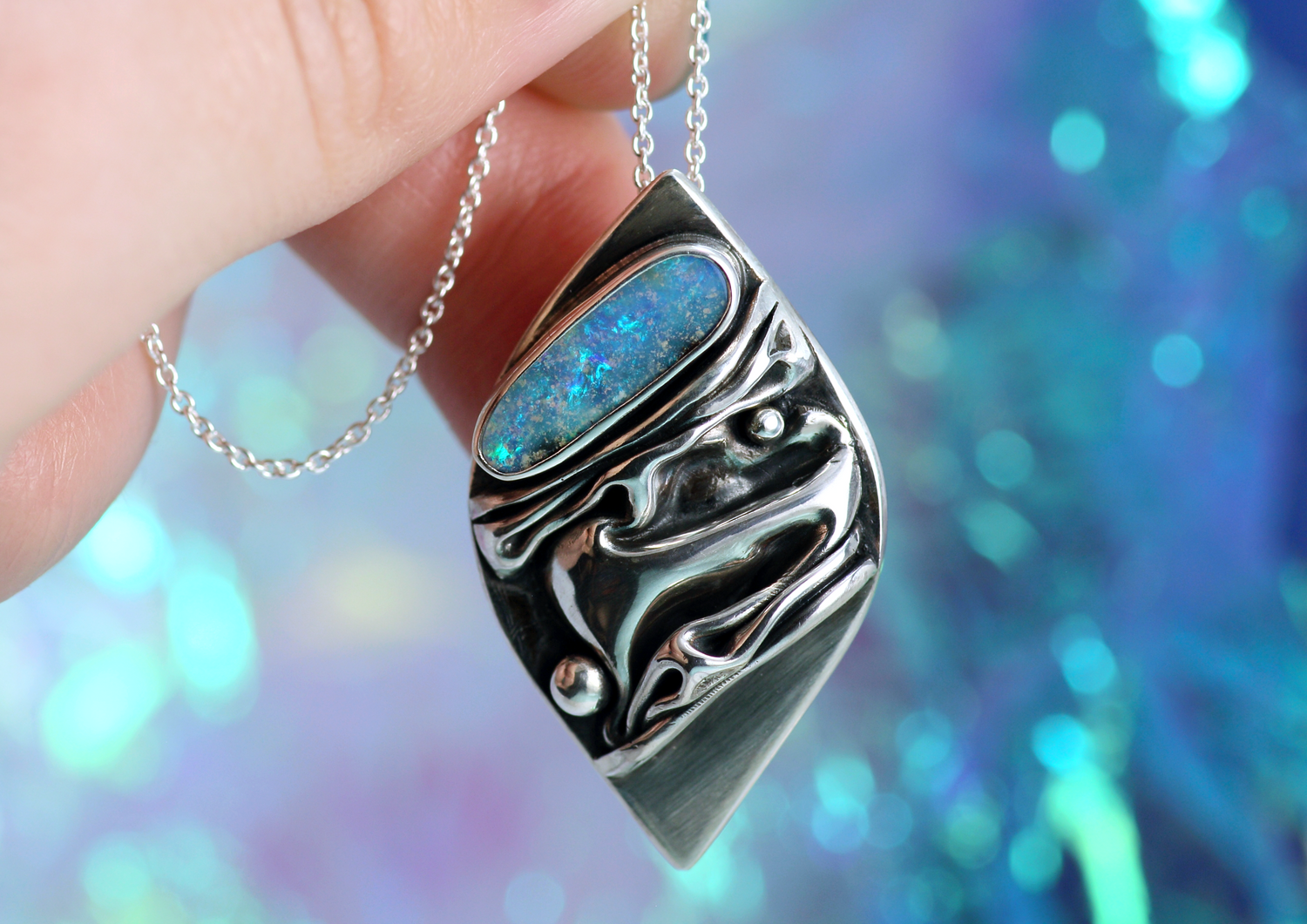 CORAL Artful silver pendant with ocean-blue opal 